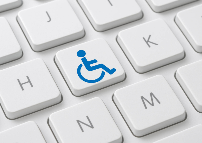 Abbild eines Rollstuhlfahrers auf der Tastatur